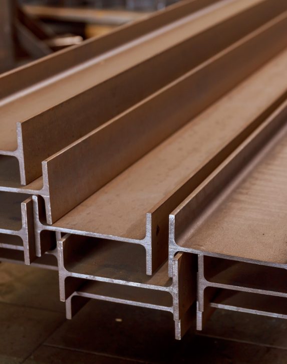 The stack of rolled metal is at the factory, overlooking the steel profile. Heavy metallurgy.